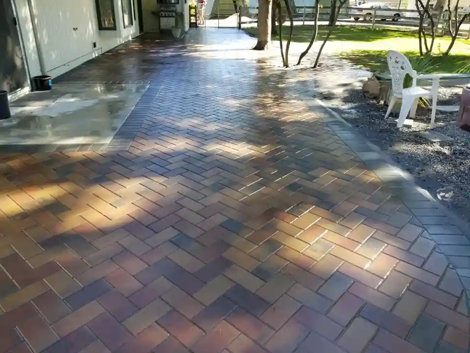 Premium flagstone patio installation with natural stone edging and xeriscaping in Osoyoos