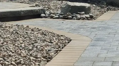 Large-scale interlocking paver patio with herringbone pattern for Osoyoos residential project